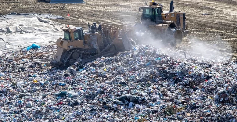Trash is flattened and spread out across a hilllside before being covered with dirt at the Prima Deshecha landfill in San Juan Capistrano, California on Thursday, March 10, 2022. (Photo: Mark Rightmire/MediaNews Group/Orange County Register via Getty Images)